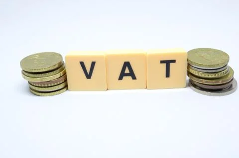 Finance Concept with Stack of Coins - VAT (Value Added Tax ) written on. Stock Photos