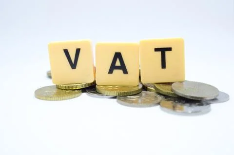 Finance Concept with Stack of Coins - VAT (Value Added Tax ) written on. Stock Photos