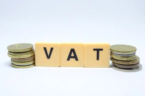 Finance Concept with Stack of Coins - VAT (Value Added Tax ) written on. Stock Photos