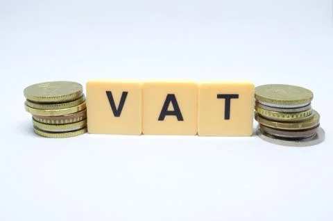 Finance Concept with Stack of Coins - VAT (Value Added Tax ) written on. Stock Photos