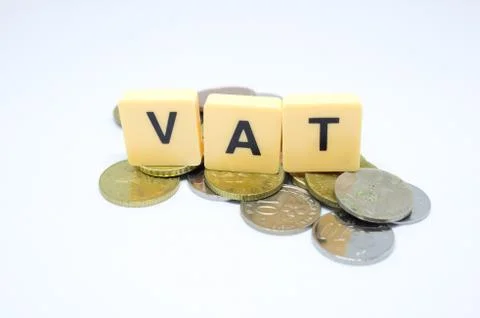 Finance Concept with Stack of Coins - VAT (Value Added Tax ) written on. Stock Photos