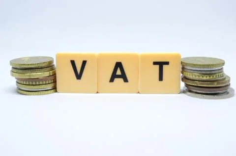 Finance Concept with Stack of Coins - VAT (Value Added Tax ) written on. Stock Photos