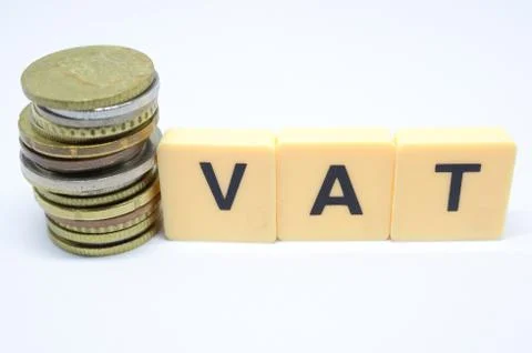 Finance Concept with Stack of Coins - VAT (Value Added Tax ) written on. Stock Photos