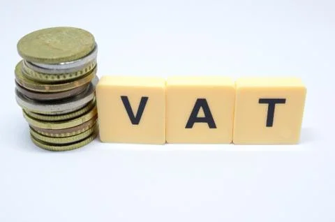Finance Concept with Stack of Coins - VAT (Value Added Tax ) written on. Stock Photos