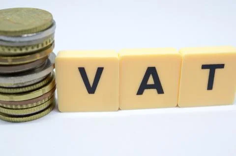 Finance Concept with Stack of Coins - VAT (Value Added Tax ) written on. Stock Photos