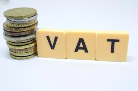 Finance Concept with Stack of Coins - VAT (Value Added Tax ) written on. Stock Photos