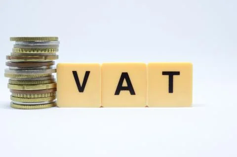 Finance Concept with Stack of Coins - VAT (Value Added Tax ) written on. Stock Photos