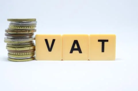 Finance Concept with Stack of Coins - VAT (Value Added Tax ) written on. Stock Photos