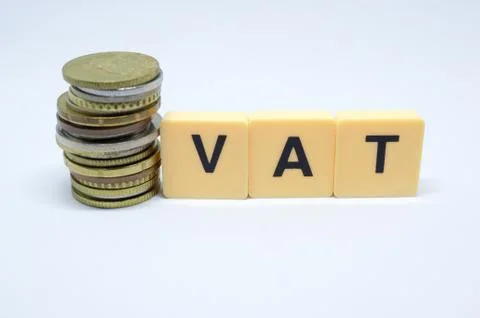 Finance Concept with Stack of Coins - VAT (Value Added Tax ) written on. Stock Photos