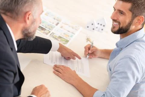 Finance consultant showing mortgage contract Stock Photos