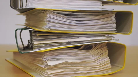 Finance documents in folders. Stacks of files and paperwork in the office Stock Footage