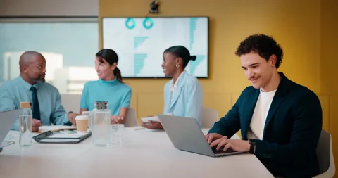 Finance, laptop and typing with man in meeting for review of data charts or Stock Footage 335451969
