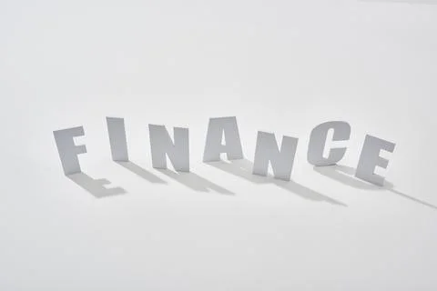 Finance lettering shadows white background Stock Photos