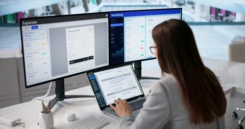 Finance Manager Analyzes Tax Documents Digitally On Laptop Stock Photos