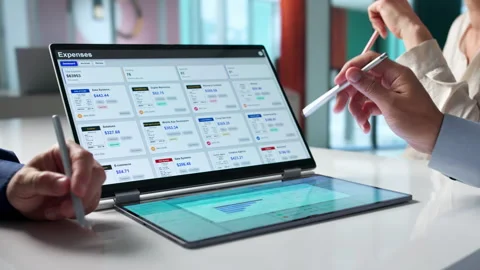 Finance Manager Leads Diverse Team Tracking Expenses Using Digital Tools Stock Footage 336789142
