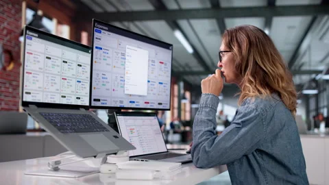 Finance Manager Reviewing Expense Reports On Laptop Stock Footage 337633478