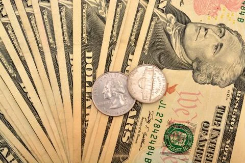 Finance money background with dollar notes and coins Stock Photos