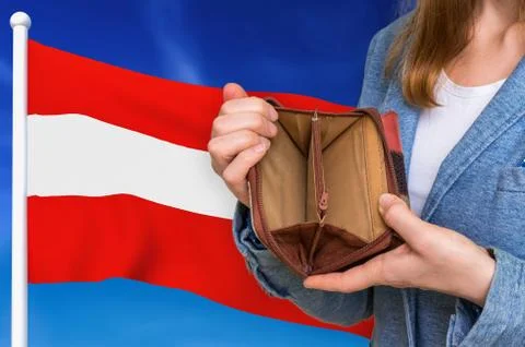 Finance problem in Austria. Poor person with empty wallet on national flag ba Stock Photos
