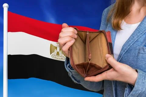 Finance problem in Egypt. Poor person with empty wallet on national flag back Stock Photos