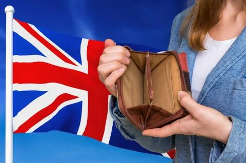 Finance problem in United Kingdom. Poor person with empty wallet on national  Stock Photos