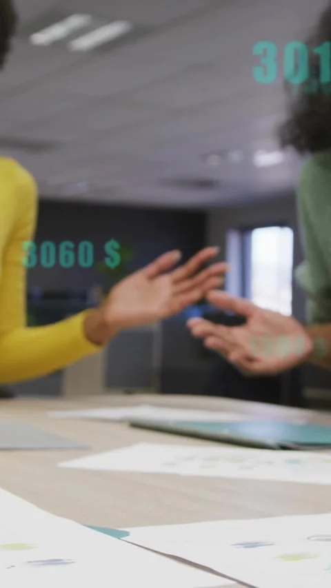 Finance team reaching, hands stacking over docs causing teal value overlays Stock Footage 330273109