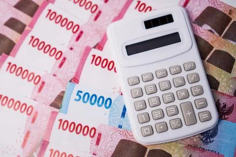 A financial accounting presentation layout featuring a white electronic cal.. Stock Photos