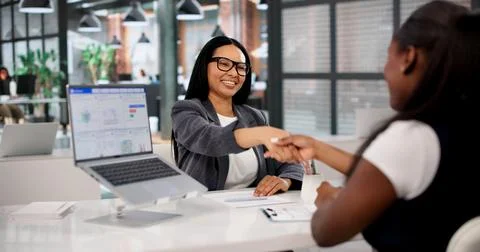 Financial Advisor And Client Shaking Hands To Finalize Mortgage Agreement Con Stock Photos