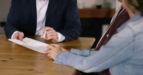Financial Advisor pointing with pen on contract Stock Footage 82184446