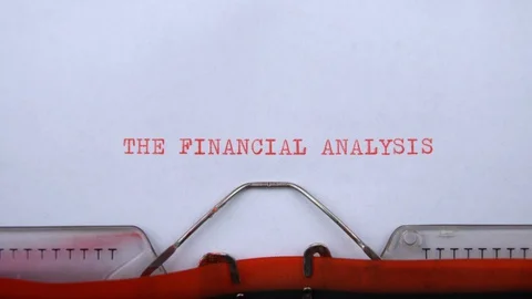The financial analysis - phrase printed on an old typewriter in red letters Video stock 129535590