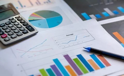 Financial analysis sheet data with pen and calculator. Accounting financial.. Stock Photos
