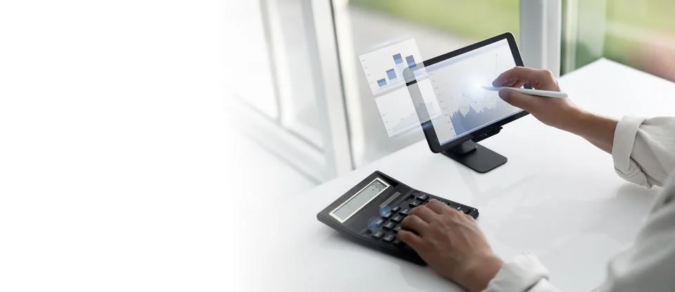 Financial Analysis Using Tablet and Calculator 写真素材