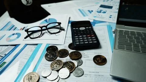 Financial Analysis Workspace with Calculator and Coins, A calculator, coins.. 스톡 동영상 304960958