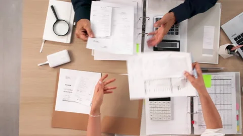 Financial Analyst Carefully Reviewing Documents During Merger Due Diligence Stock Footage 335877279