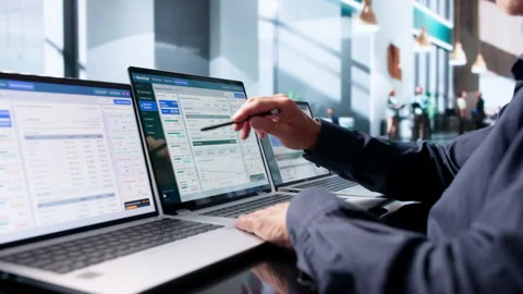 Financial Analyst Carefully Reviews Cloud Spending Reports Stock Footage 345319159