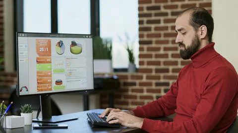 Financial analyst creating e commerce data graphs on screen Stock Photos