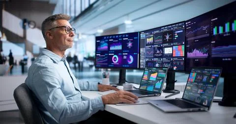 Financial Analyst Explains Key Metrics On Laptop, Reviewing Market Data Close Stock Photos