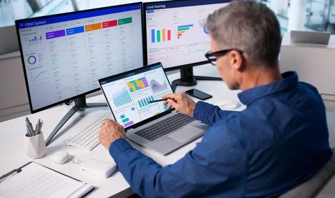 Financial Analyst Man Using CRM System To Boost Sales Process Stock Photos