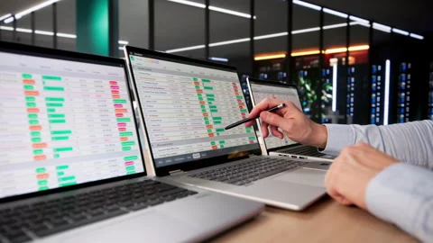 Financial Analyst Man Using Spreadsheet Software On Laptop To Analyze Data Stock Footage 328403974