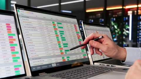 Financial Analyst Man Using Spreadsheet Software On Laptop To Analyze Data Stock Footage 328709784