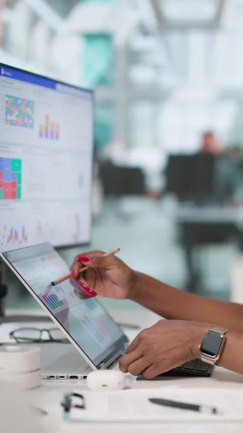 Financial Analyst Reviewing Dashboard Data On Laptop Stock Footage 338174344