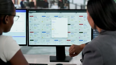 Financial Analyst Reviewing Expense Reports On Desktop Computer Stock Footage 333402016