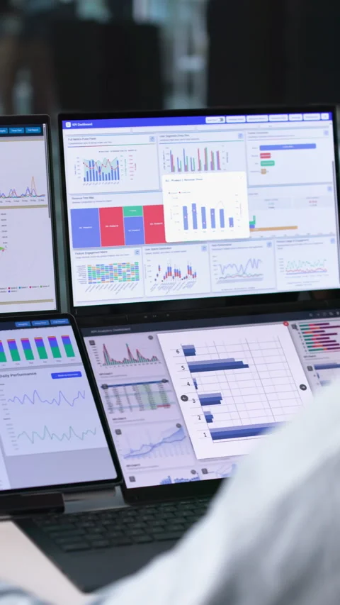 Financial Analyst Reviewing Predictive Data Charts On Laptop Stock Footage 344711806