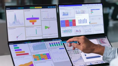 Financial Analyst Reviewing Predictive Data Charts On Laptop 動画素材 345858579