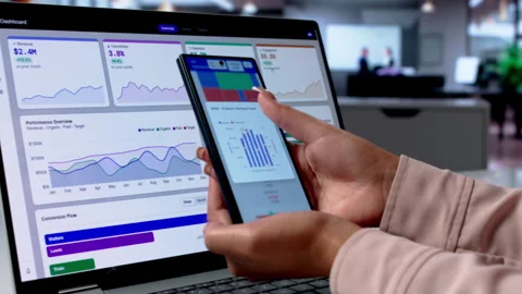 Financial Analyst Reviews Data Dashboard Closely On Laptop Stockbeeldmateriaal 336796089