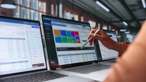 Financial Analyst Studies Cloud Cost Reports On Laptop Stock Footage 345314118