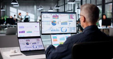 Financial Analyst Studies Real-time Market Data On Large Touchscreen Dashboar Stock Photos