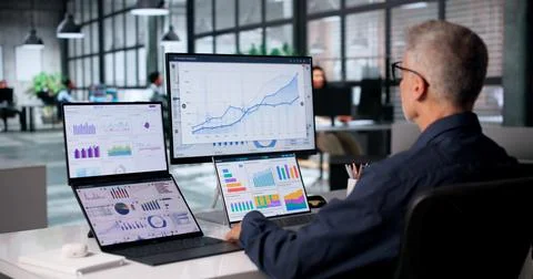 Financial Analyst Studies Real-time Market Data On Touchscreen Dashboard. Stock Photos