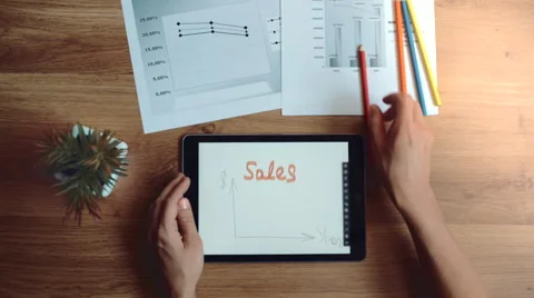 Financial analyst using graphs for sales trend Stock Footage 65203872