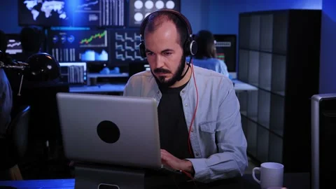 Financial Analyst Working on a Computer with Multi-Monitor Workstation Stocks Stock Footage 176317006