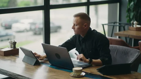 Financial Analyst Working Remotely From Cafe, Portrait Of Freelancer Man With Stock Footage 243311820